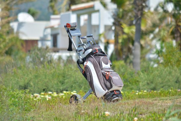 Golf bag, Golf clubs in golf bag on the fairway.