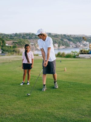 Happy Family Playing Golf